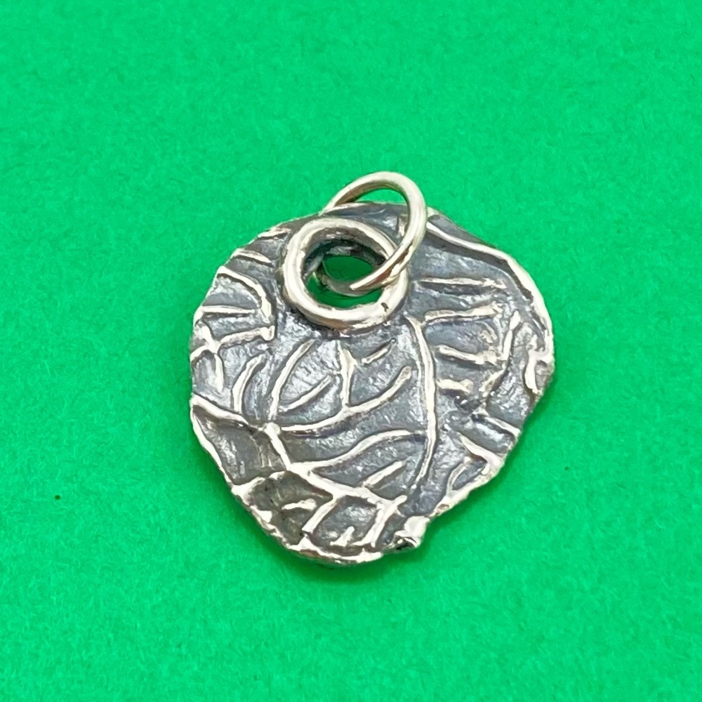 Waxing poetic leaf charm